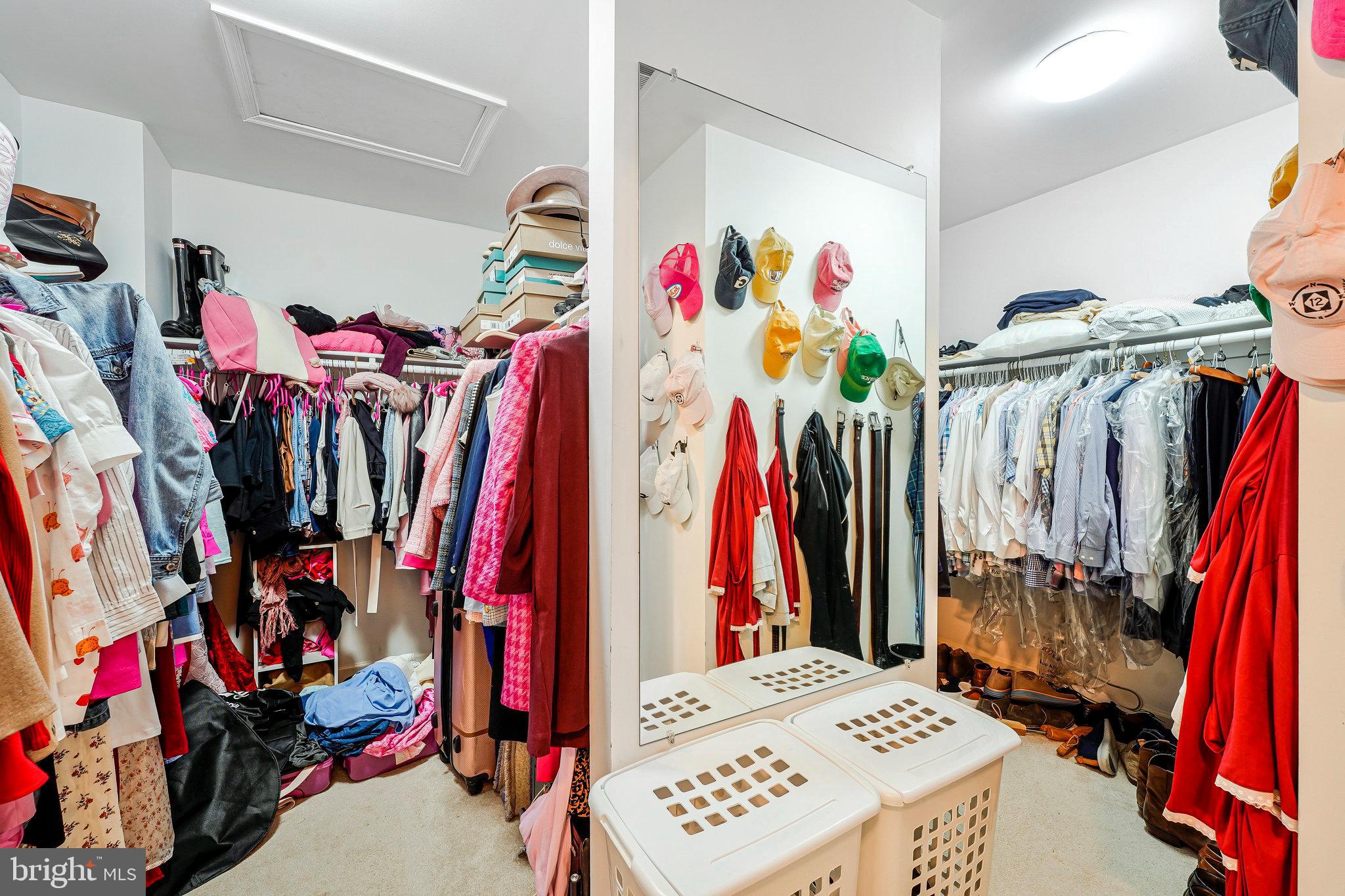 20627 Cutwater Place Sterling, VA 20165 - Photo 23 of 42 a view of walk in closet with clothes