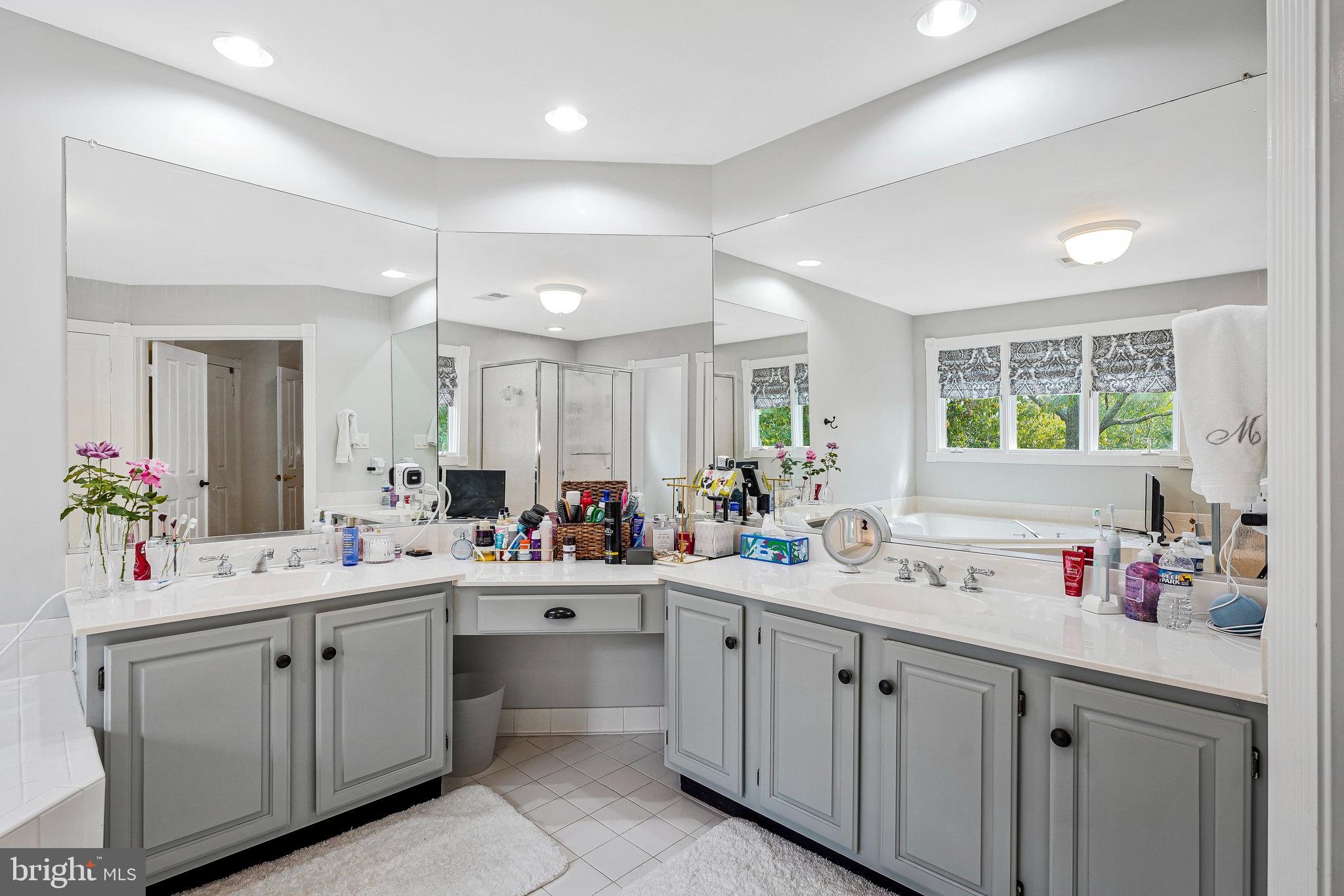 20627 Cutwater Place Sterling, VA 20165 - Photo 24 of 42 a kitchen with sink cabinets and white appliances