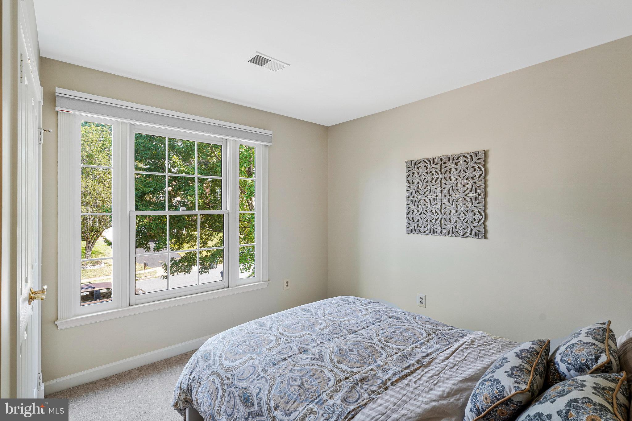 20627 Cutwater Place Sterling, VA 20165 - Photo 27 of 42 a bedroom with a bed and a window