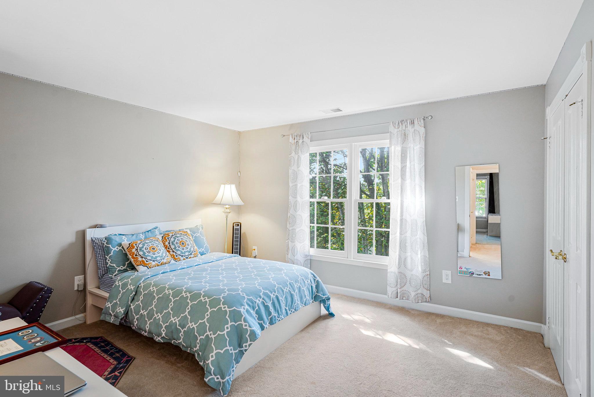 20627 Cutwater Place Sterling, VA 20165 - Photo 31 of 42 a bedroom with a bed and a window