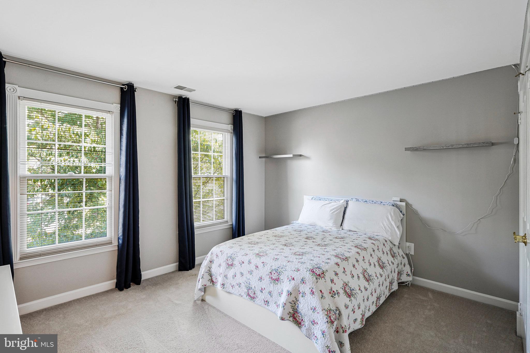 20627 Cutwater Place Sterling, VA 20165 - Photo 33 of 42 a bed sitting in a spacious bedroom next to a window