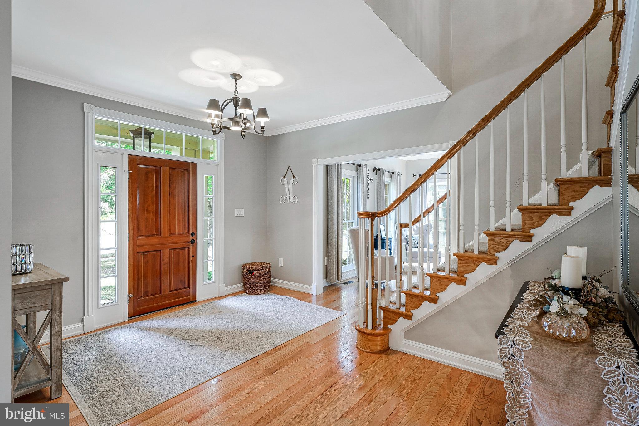 20627 Cutwater Place Sterling, VA 20165 - Photo 5 of 42 a view of entryway and hall with wooden floor