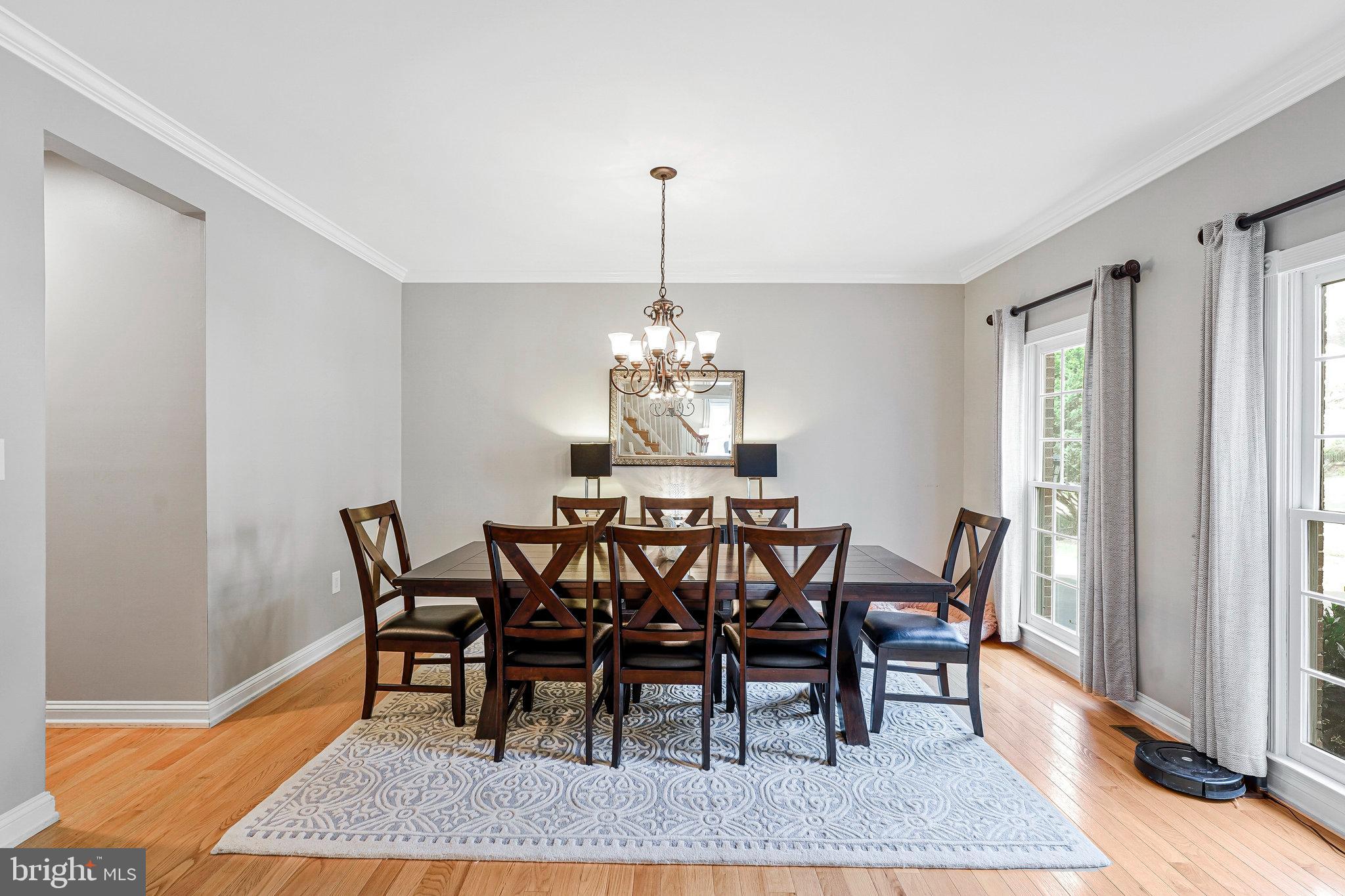 20627 Cutwater Place Sterling, VA 20165 - Photo 7 of 42 a view of a dining room with furniture and wooden floor