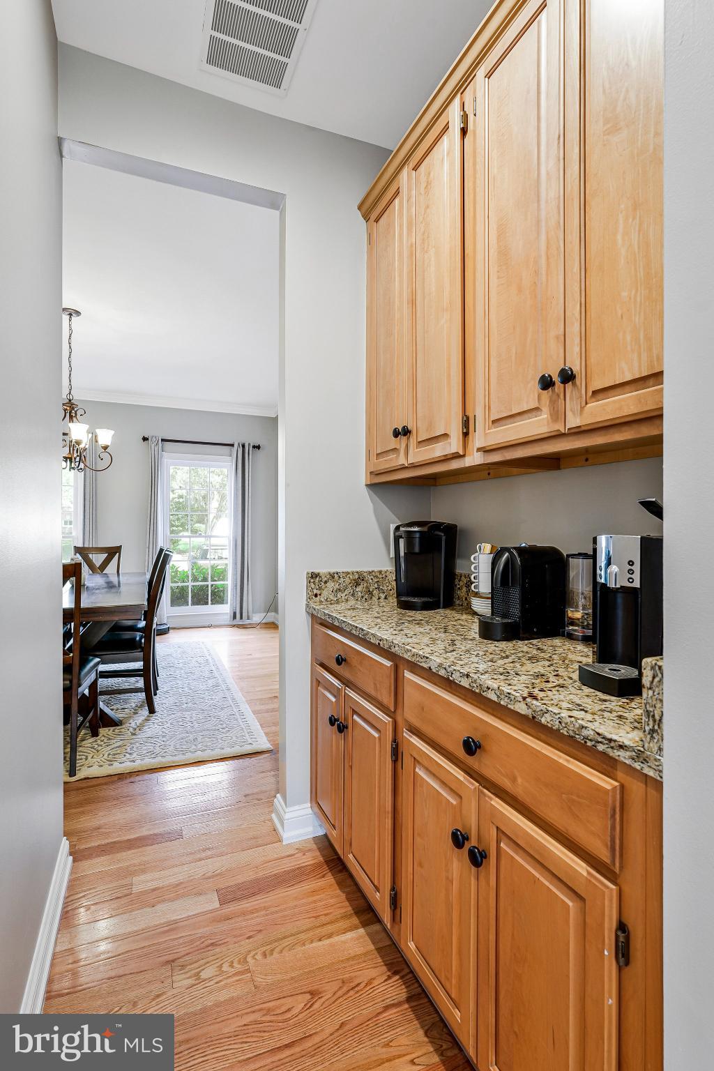 20627 Cutwater Place Sterling, VA 20165 - Photo 8 of 42 a kitchen with stainless steel appliances granite countertop a stove a sink and a microwave