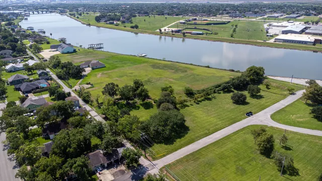 an aerial view of a residential houses with outdoor space