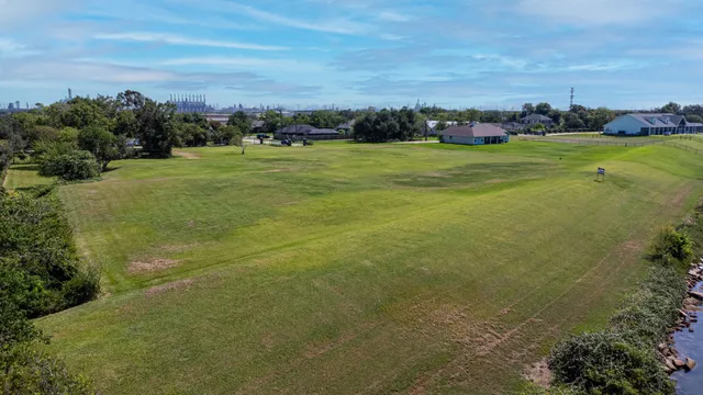 a view of a big yard with a lake view and mountain view