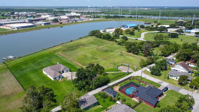 an aerial view of a house with a lake view