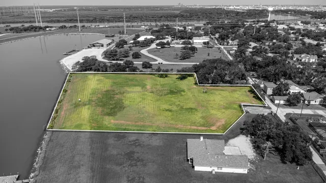 an aerial view of a residential houses with outdoor space