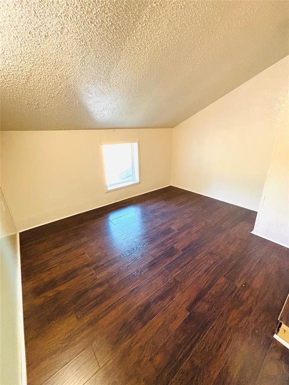 9696 Walnut Street, Unit 1305 Dallas, TX 75243 - Photo 14 of 25 a view of an empty room and wooden floor