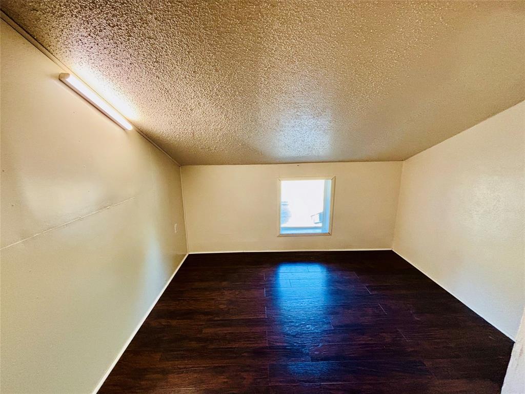 9696 Walnut Street, Unit 1305 Dallas, TX 75243 - Photo 16 of 25 a view of an empty room with wooden floor