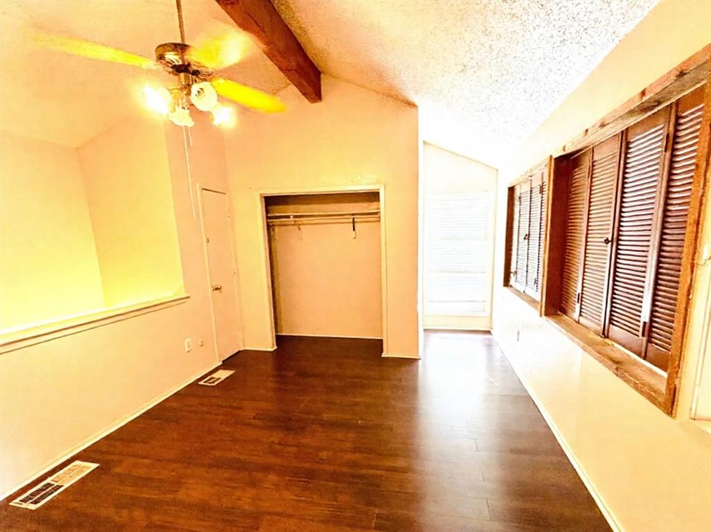 9696 Walnut Street, Unit 1305 Dallas, TX 75243 - Photo 18 of 25 a view of empty room with wooden floor and fan