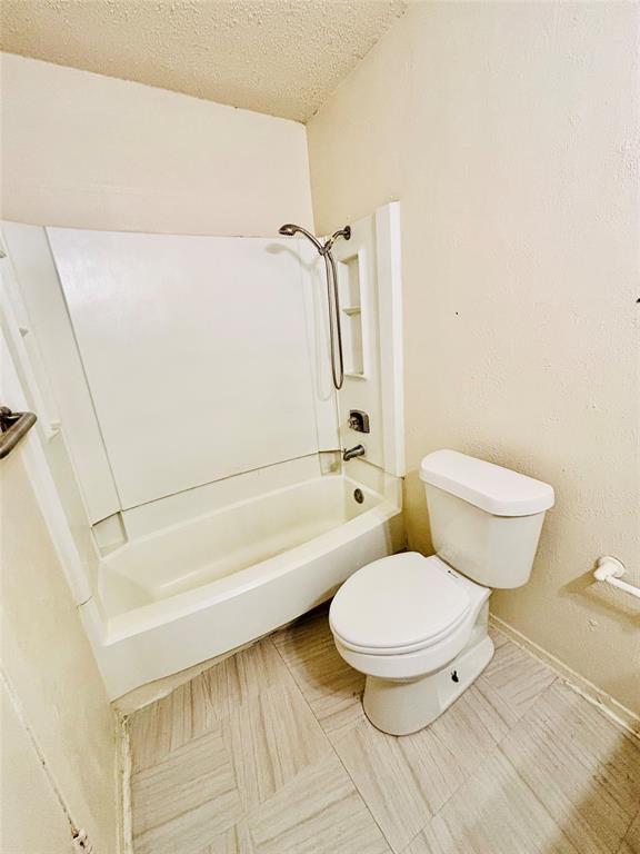 9696 Walnut Street, Unit 1305 Dallas, TX 75243 - Photo 21 of 25 a bathroom with a toilet and a shower