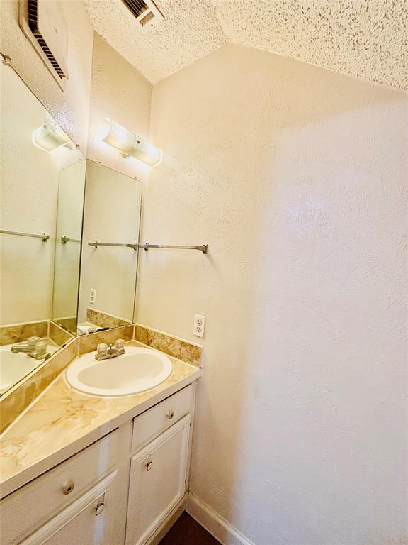 9696 Walnut Street, Unit 1305 Dallas, TX 75243 - Photo 23 of 25 a bathroom with a sink and a mirror