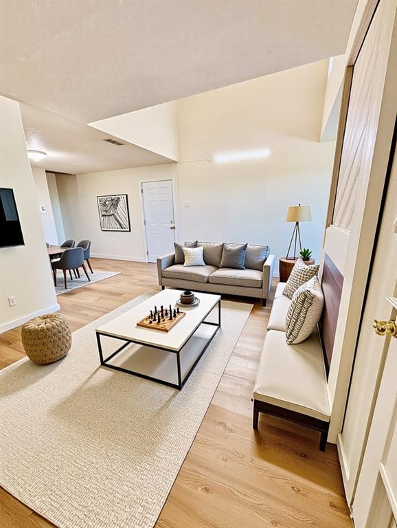 9696 Walnut Street, Unit 1305 Dallas, TX 75243 - Photo 6 of 25 a living room with furniture and a rug