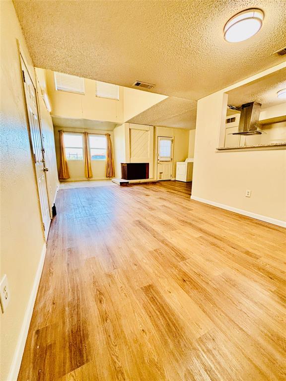 9696 Walnut Street, Unit 1305 Dallas, TX 75243 - Photo 8 of 25 a view of empty room with wooden floor and fan