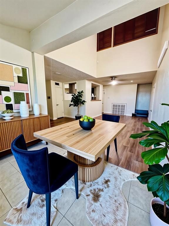 9696 Walnut Street, Unit 1305 Dallas, TX 75243 - Photo 9 of 25 a dining room with furniture and wooden floor