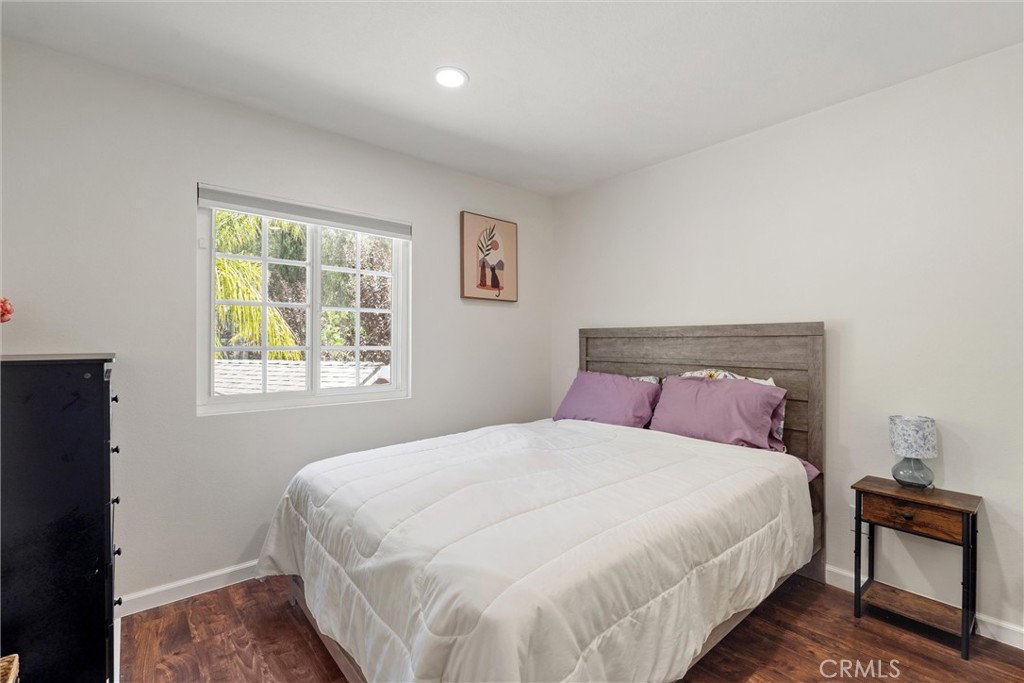 31256 Quail Valley Road Castaic, CA 91384 - Photo 6 of 16 a bedroom with a bed and a lamp with window