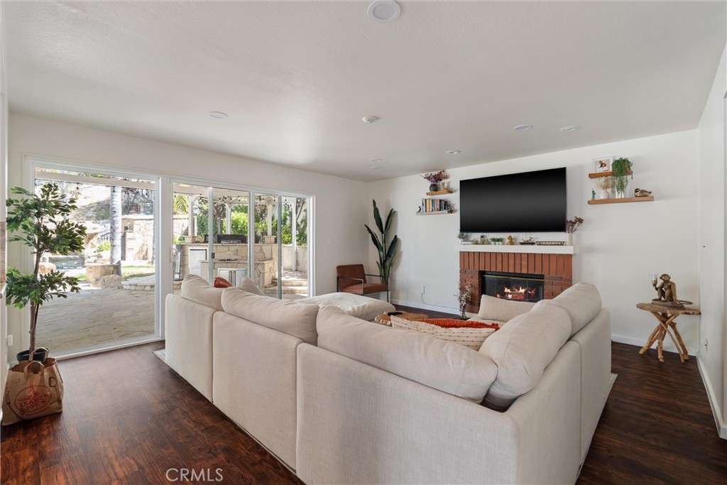 31256 Quail Valley Road Castaic, CA 91384 - Photo 7 of 16 a living room with furniture and a flat screen tv