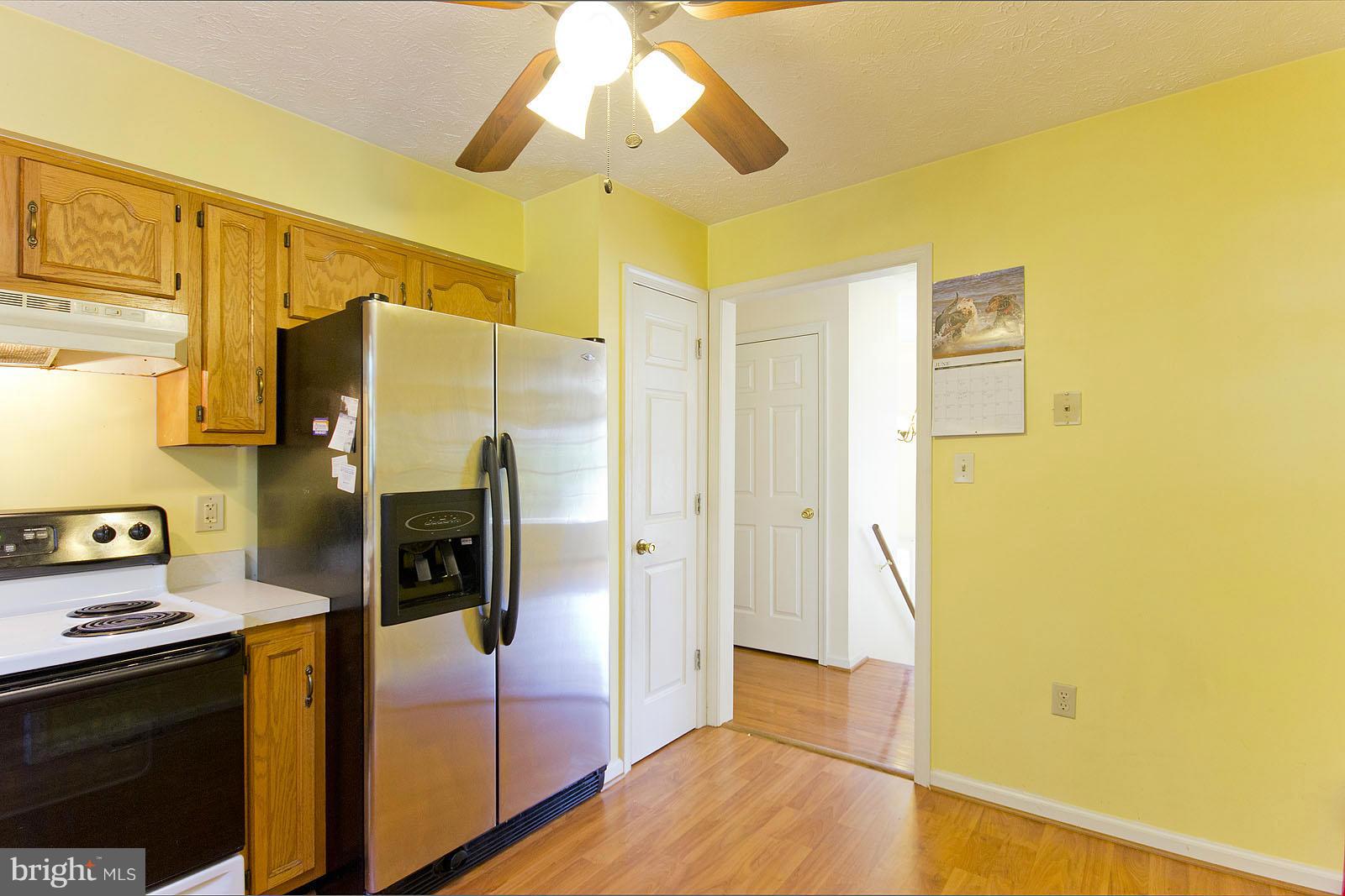 138 Charlton Road Winchester, VA 22602 - Photo 11 of 30 a kitchen with a refrigerator and a stove