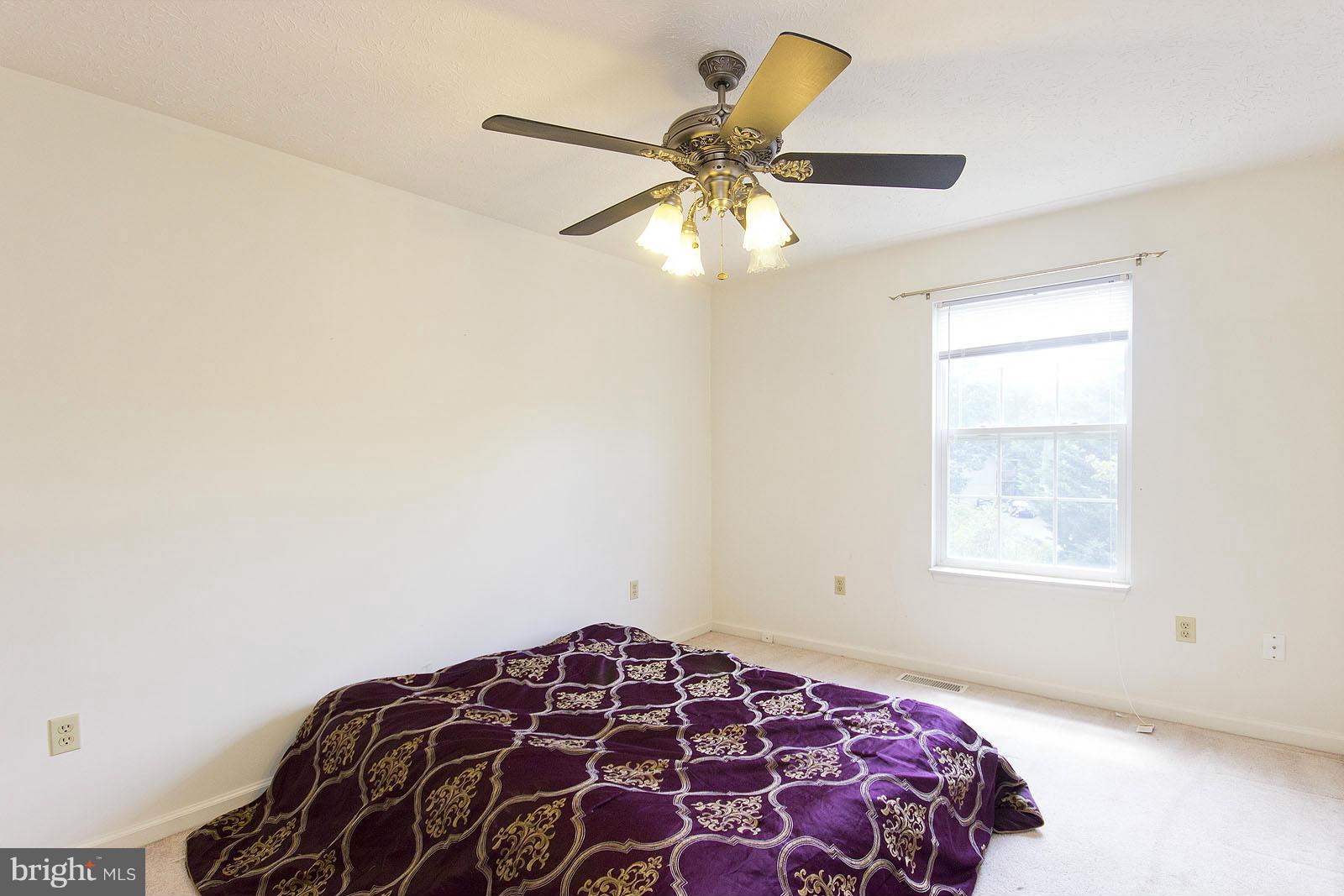 138 Charlton Road Winchester, VA 22602 - Photo 19 of 30 a bedroom with a bed and a window