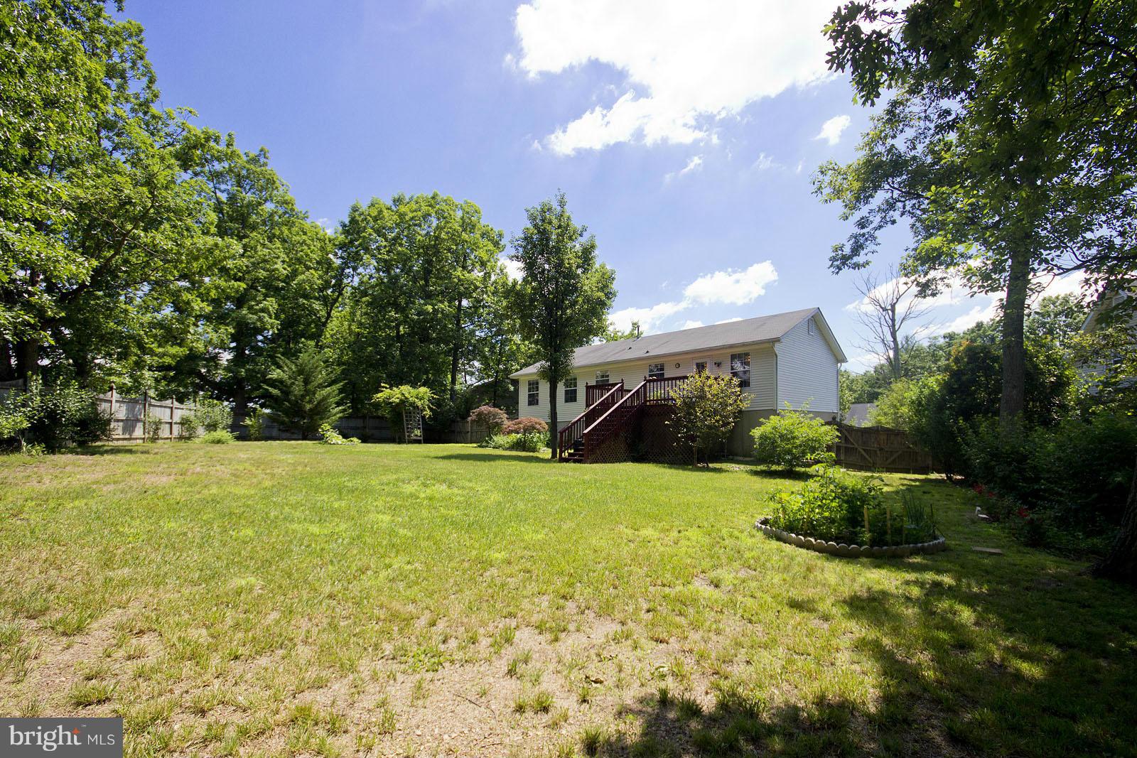 138 Charlton Road Winchester, VA 22602 - Photo 28 of 30 a front view of a house with garden