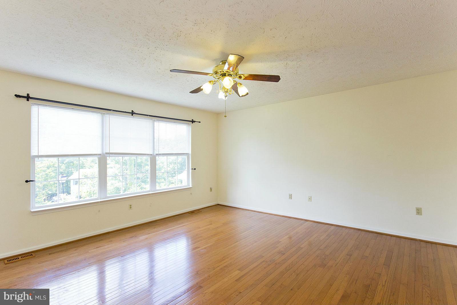 138 Charlton Road Winchester, VA 22602 - Photo 5 of 30 wooden floor in an empty room with a window
