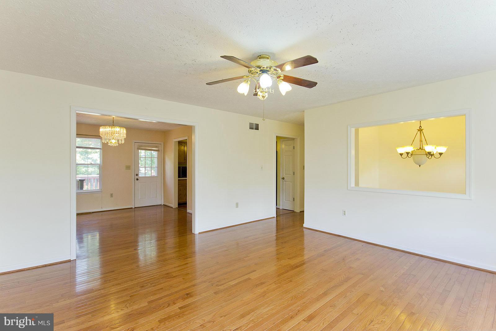 138 Charlton Road Winchester, VA 22602 - Photo 6 of 30 a view of empty room with wooden floor