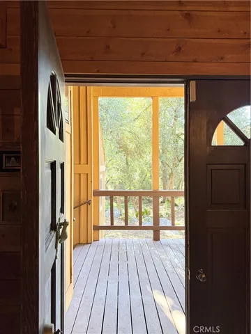 a view of a building with furniture and a fire pit