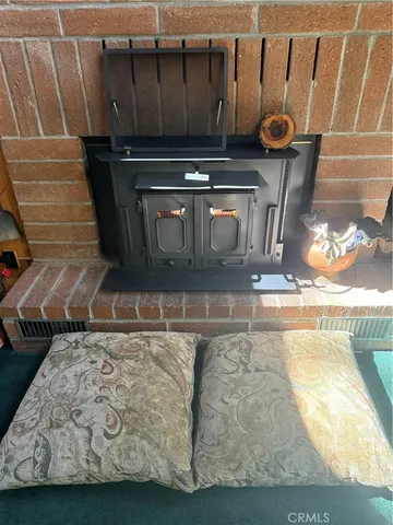 a vase of flowers sitting on a table in front of a door
