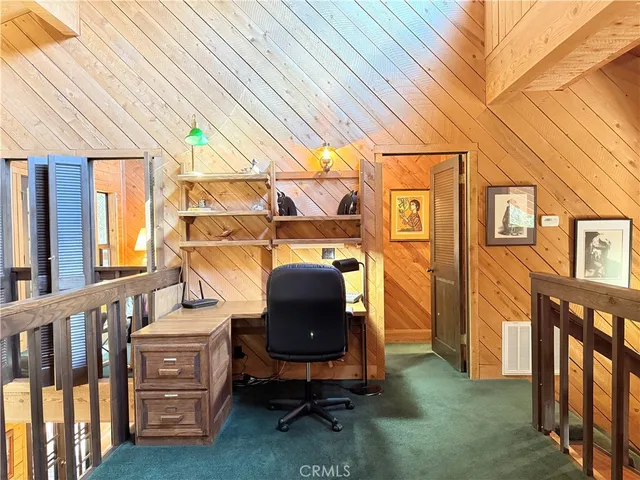 a bedroom with a large bed and a large window