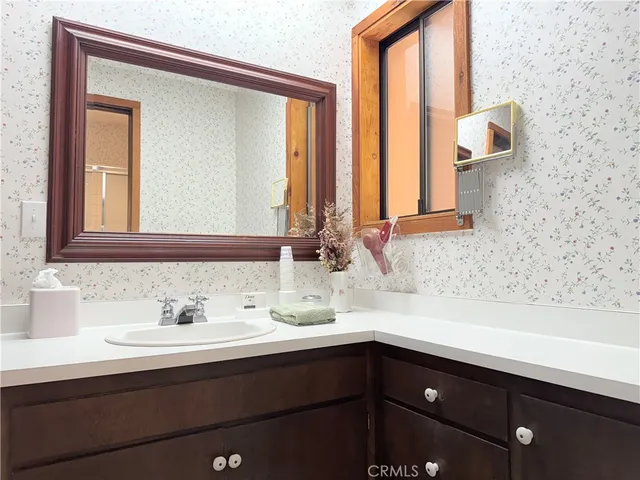 a bathroom with a sink and a mirror
