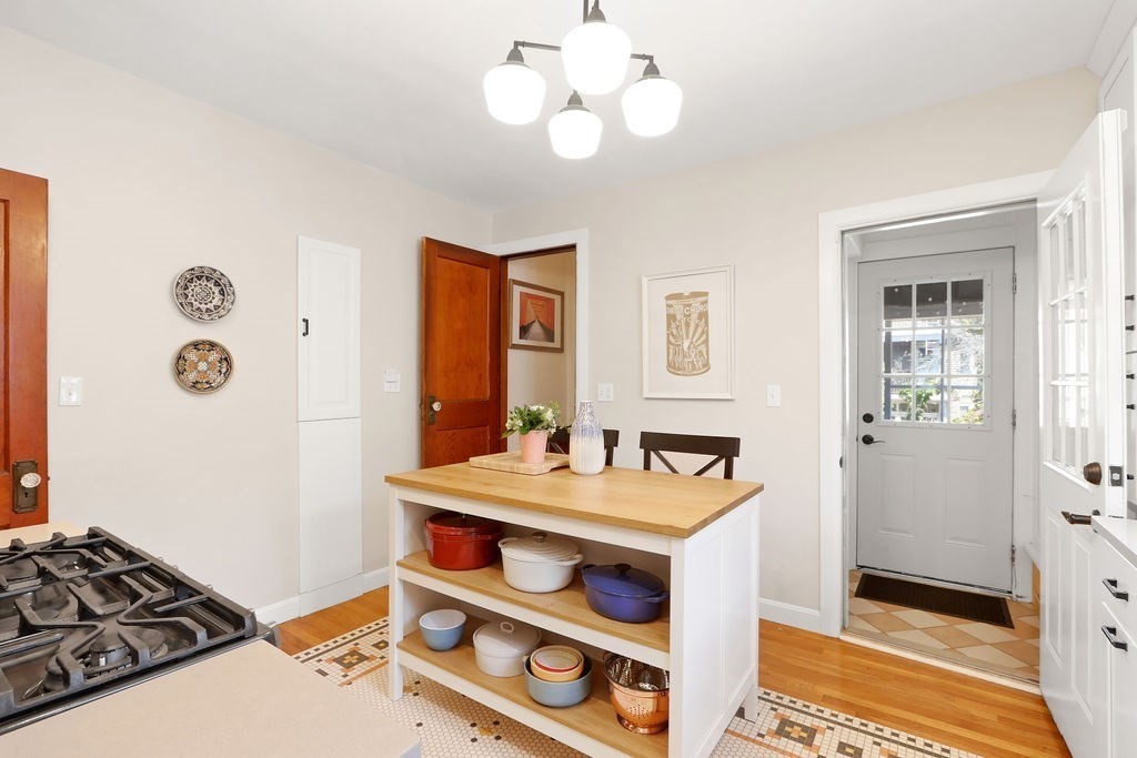 43-45 Owencroft Road, Unit 2 Boston, MA 02124 - Photo 14 of 36 a view of a dining room with furniture and a chandelier