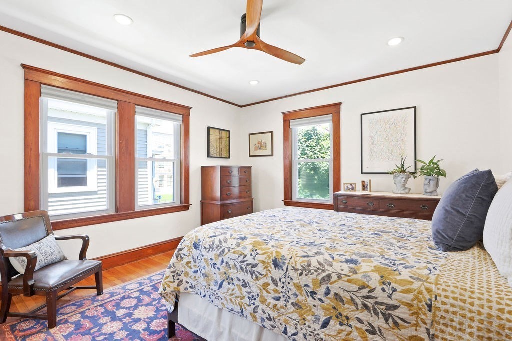 43-45 Owencroft Road, Unit 2 Boston, MA 02124 - Photo 16 of 36 a bedroom with a bed and glass windows
