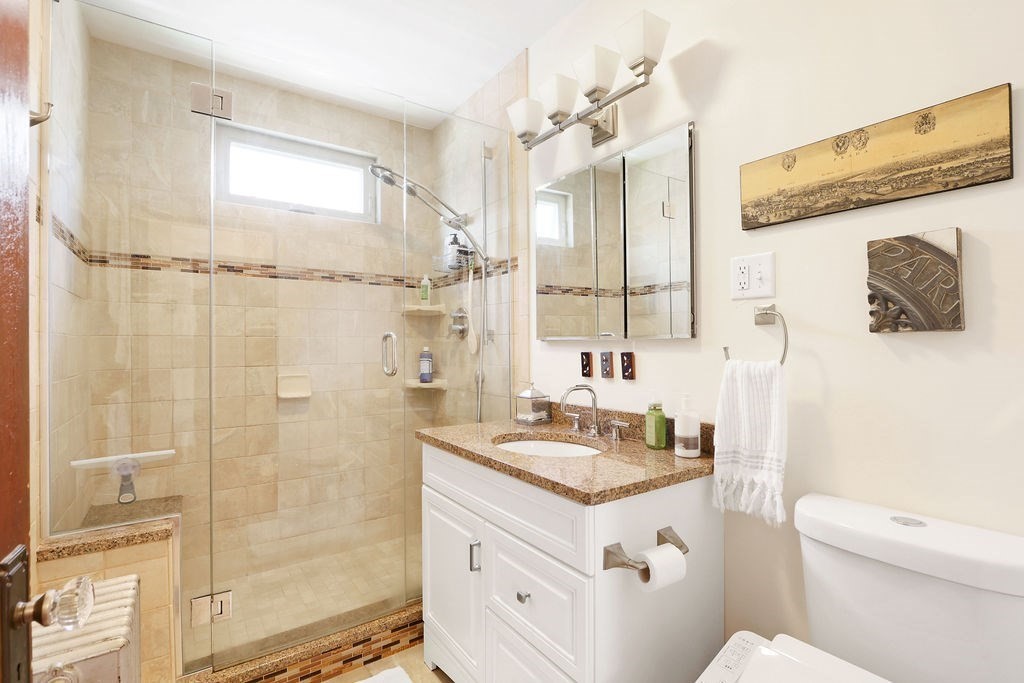 43-45 Owencroft Road, Unit 2 Boston, MA 02124 - Photo 18 of 36 a bathroom with a granite countertop sink toilet and shower