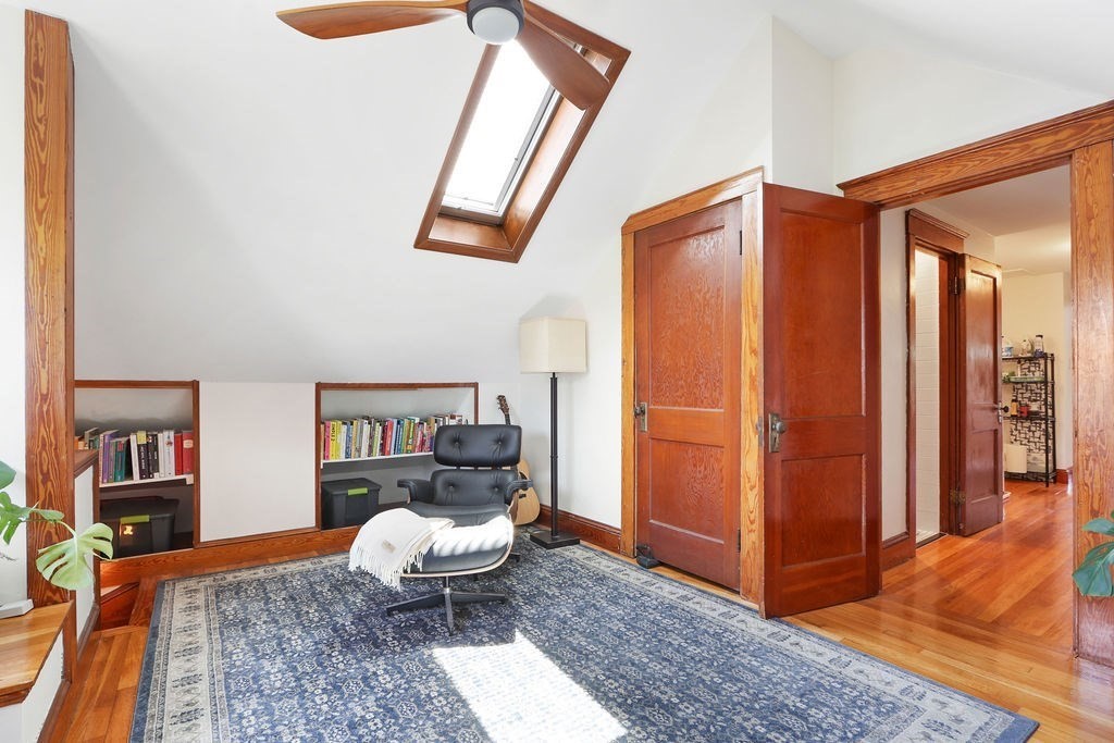 43-45 Owencroft Road, Unit 2 Boston, MA 02124 - Photo 22 of 36 a living room with furniture and wooden floor