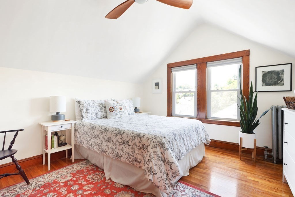 43-45 Owencroft Road, Unit 2 Boston, MA 02124 - Photo 25 of 36 a bedroom with a bed and wooden floor