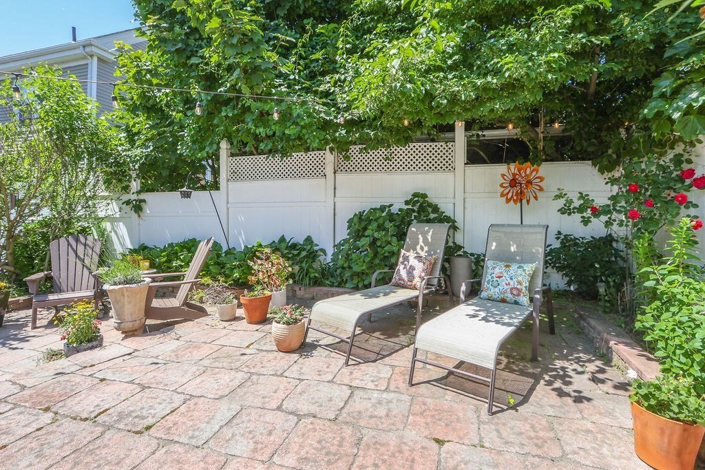 43-45 Owencroft Road, Unit 2 Boston, MA 02124 - Photo 30 of 36 a view of a backyard with sitting area