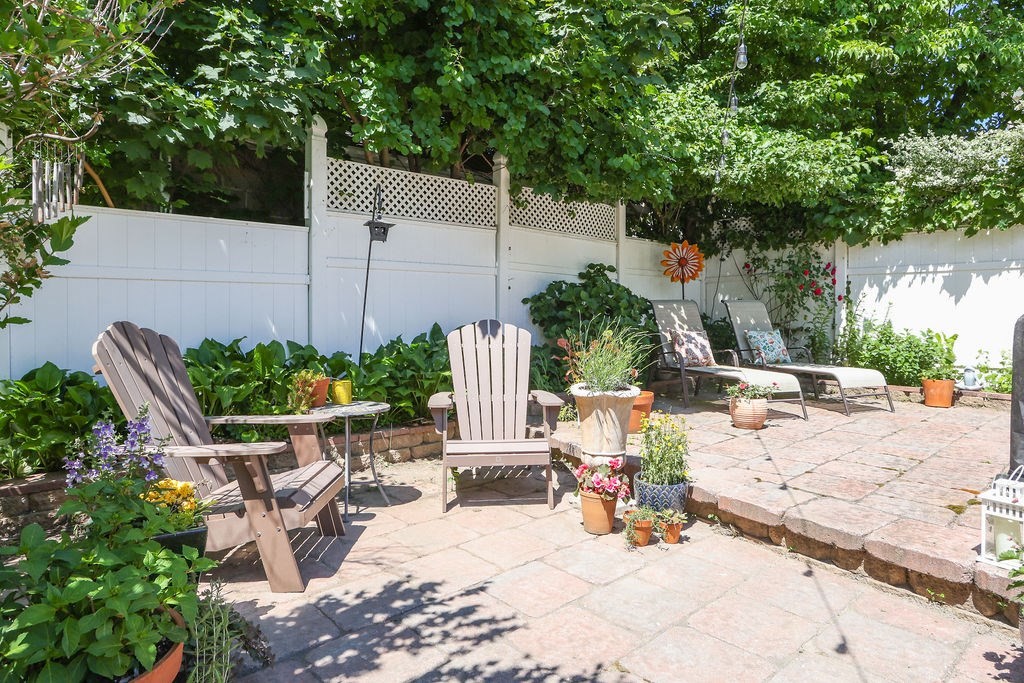 43-45 Owencroft Road, Unit 2 Boston, MA 02124 - Photo 33 of 36 a view of a patio with chairs and potted plants