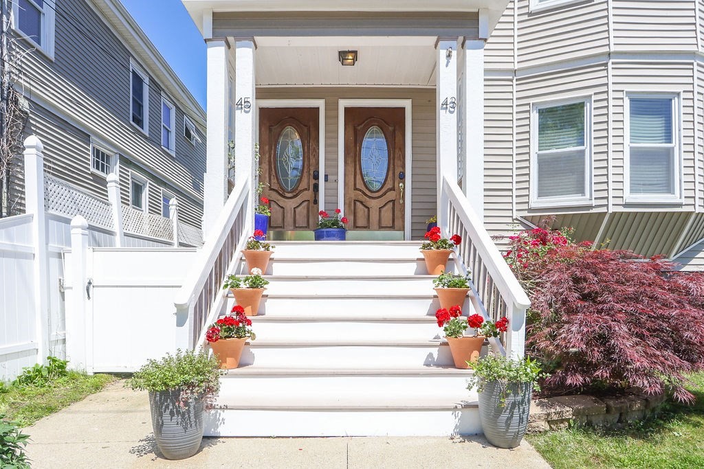 43-45 Owencroft Road, Unit 2 Boston, MA 02124 - Photo 35 of 36 a front view of a house with entryway