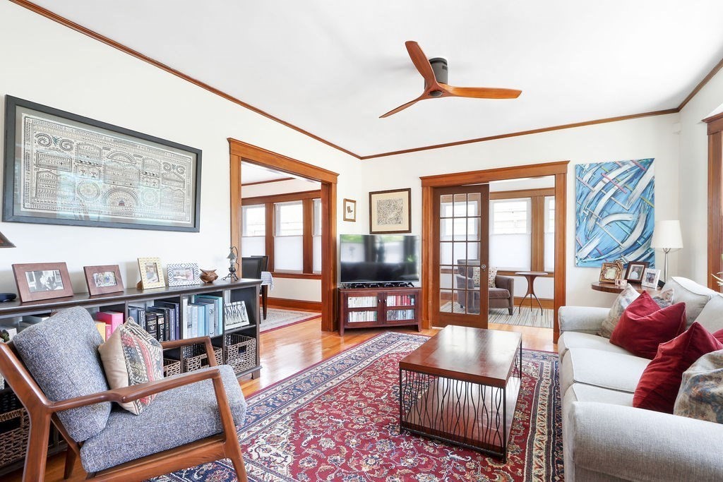 43-45 Owencroft Road, Unit 2 Boston, MA 02124 - Photo 4 of 36 a living room with furniture or couch and a dining table