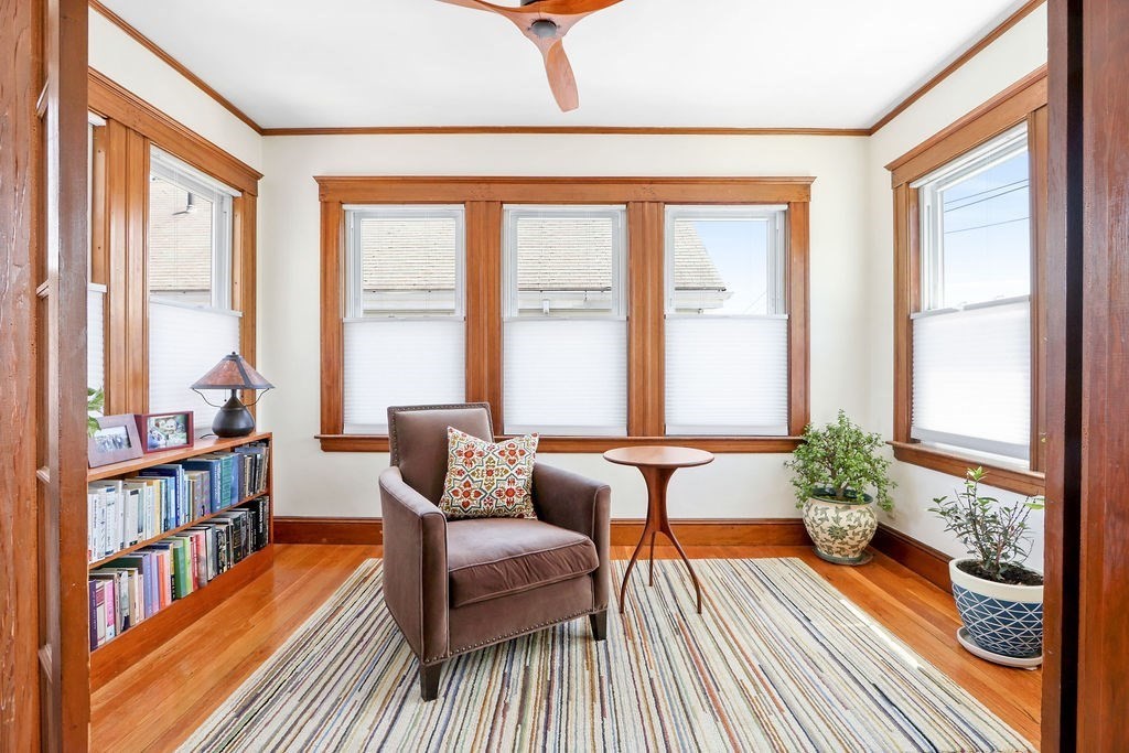 43-45 Owencroft Road, Unit 2 Boston, MA 02124 - Photo 7 of 36 a living room with furniture and a book shelf