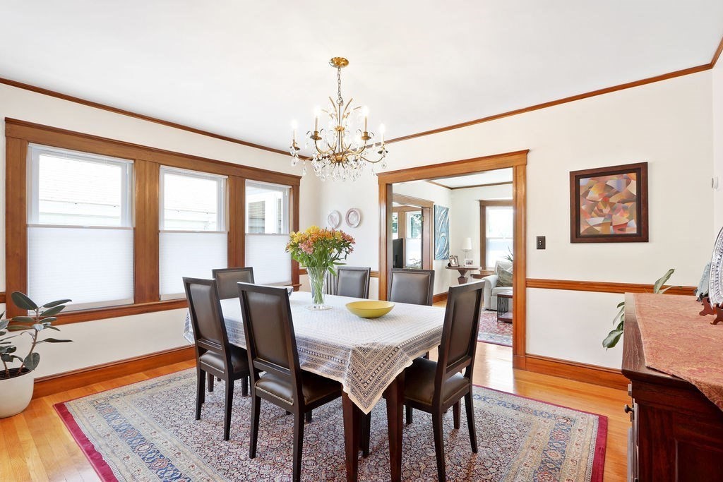 43-45 Owencroft Road, Unit 2 Boston, MA 02124 - Photo 9 of 36 a view of a dining room with furniture window and wooden floor
