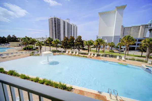 a view of a swimming pool with chairs