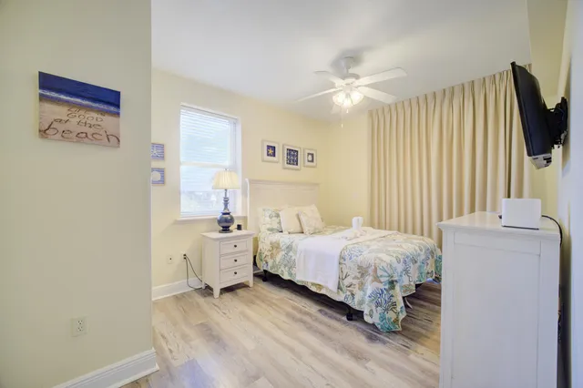 a room with a bed and a chandelier