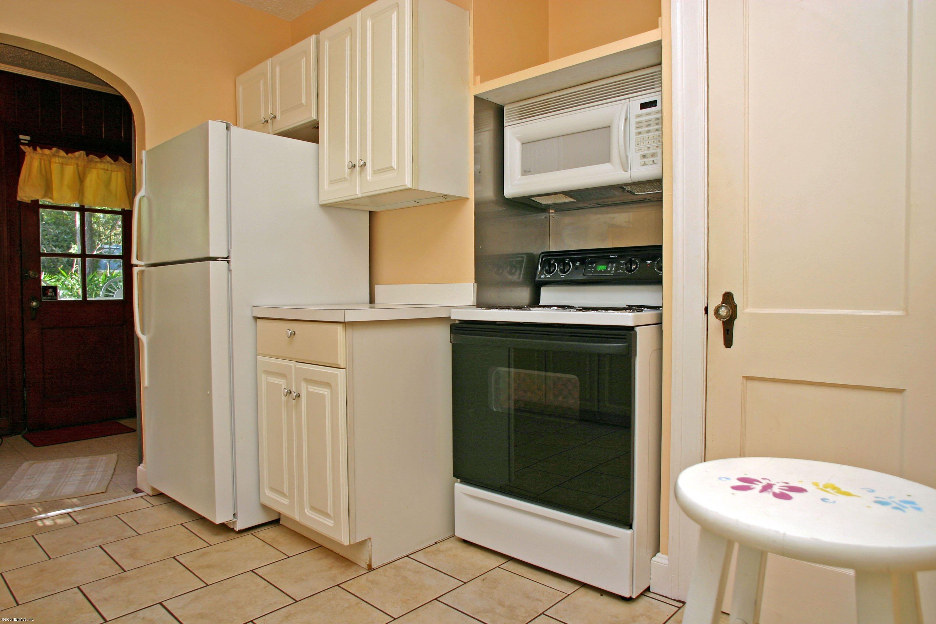 1510 Nicholson Road Jacksonville, FL 32207 - Photo 3 of 14 a kitchen with a white cabinets and white appliances
