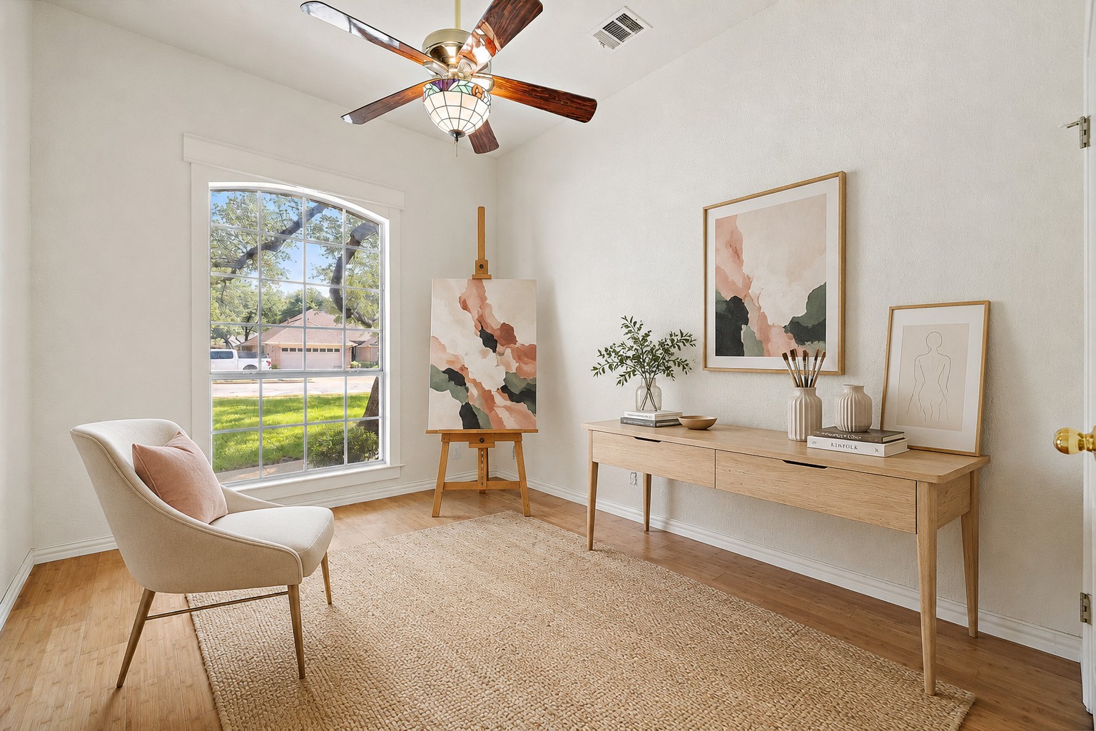1102 Nelson Ranch Road Cedar Park, TX 78613 - Photo 26 of 37 A versatile space features a bright arched window and a tasteful ceiling fan, perfect for a home office or creative studio.