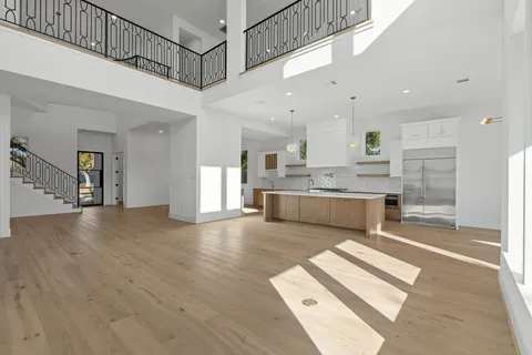 a view of empty room with a fireplace and a window