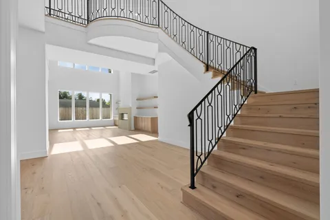 a view of living room with furniture and stairs