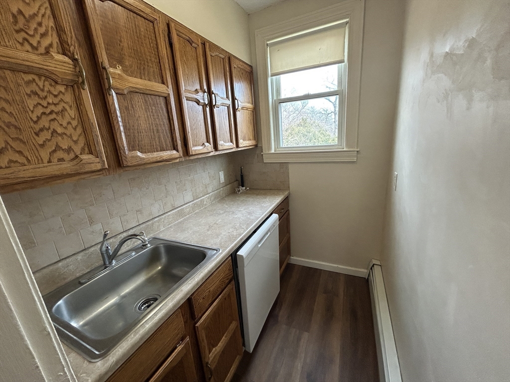 7 Wingate Street Shrewsbury, MA 01545 - Photo 15 of 21 a kitchen with a sink a stove and cabinets