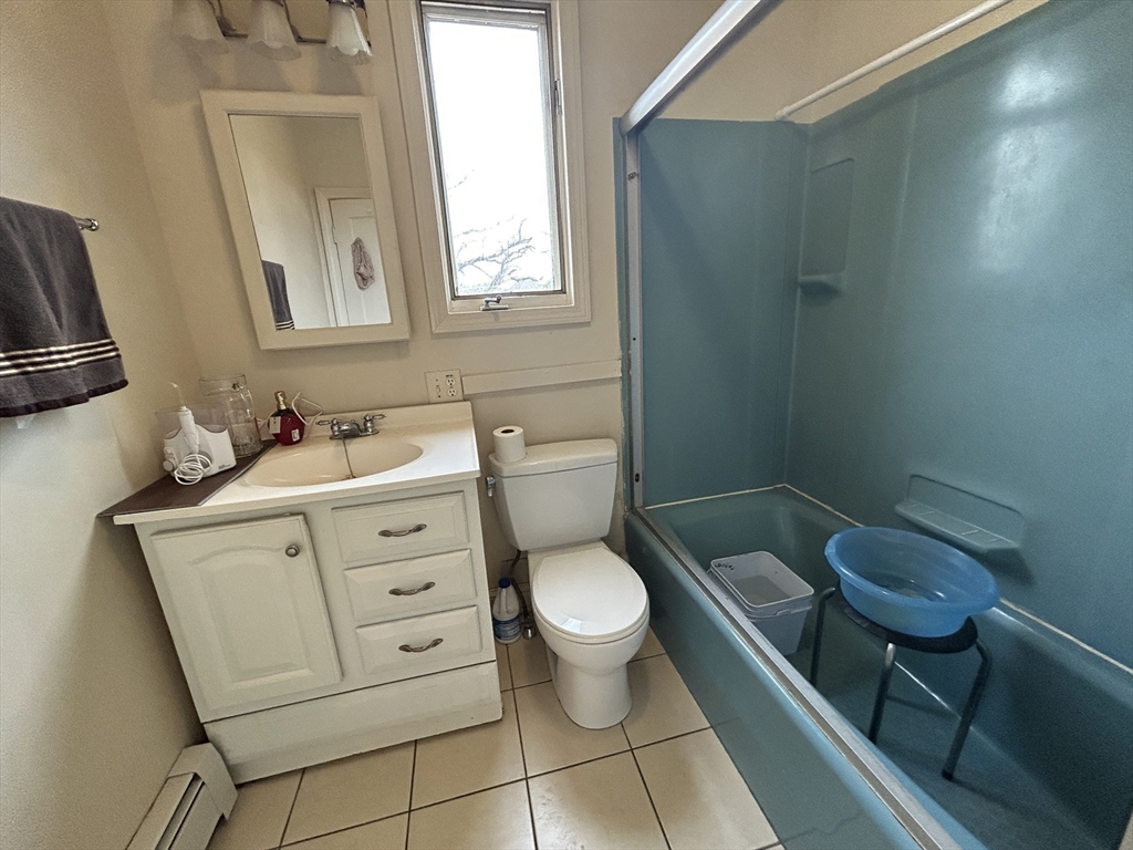 7 Wingate Street Shrewsbury, MA 01545 - Photo 16 of 21 a bathroom with a toilet sink vanity and mirror